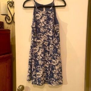 Short sleeveless, floral dress.
